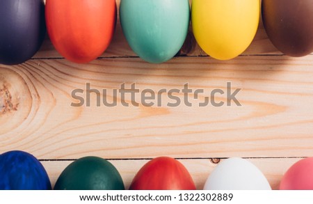 Easter eggs clean frame on wooden background, easter day concept