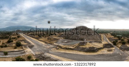 panoramic view of the ruins of Teotihuacan with colorful ballons in a sub valley of Mexico - The Avenue of the Dead and the pyramid of the sun and the moon  seen from a hot air balloon