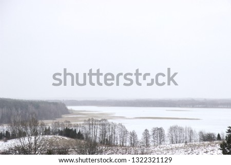 Beautiful white landscape with great frozen sea between some forests and islands. Winter nature, travel theme
