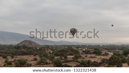 Hot air balloon with Pyramid of the Moon in background, Archaeological Zone of Teotihuacan, UNESCO World Heritage Site, Mexico
