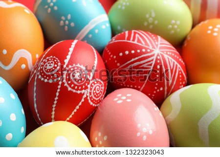 Colorful decorated Easter eggs as background, closeup