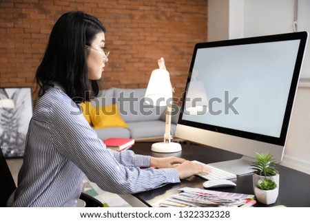 Female designer working on new logo in office