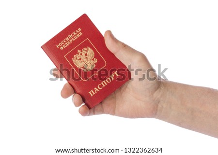 Hand with Russian passport isolated on white background