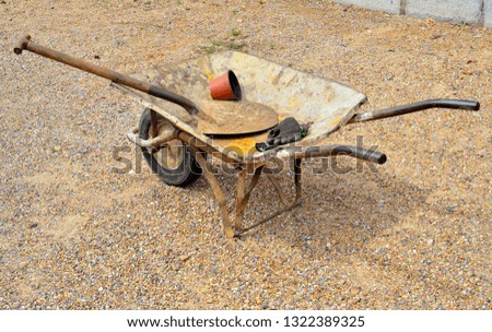 wheelbarrow, shovel and gloves. Building materials set