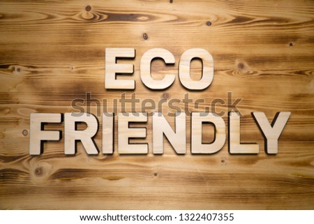 ECO FRIENDLY words made with building blocks on wooden board