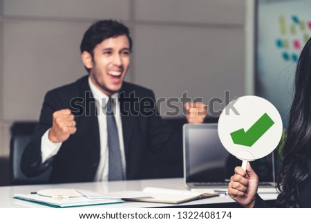 Human resource manager hire the male employment candidate who pass the interviewing, sitting in the office room. Happy OK job interview. Job application, recruitment and Asian labor hiring concept.