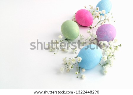 Easter color painted eggs on a white background.

