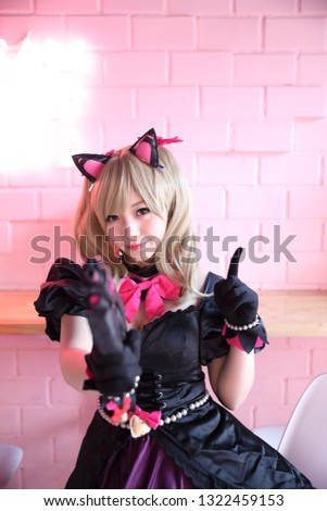 Japan anime cosplay , portrait of girl cosplay in pink room background