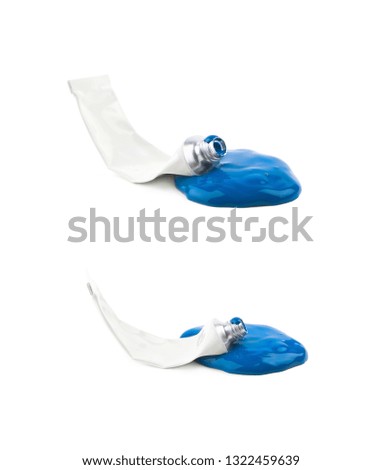 Used paint tube lying in a dye spill splash, composition isolated over the white background, set of two different foreshortenings