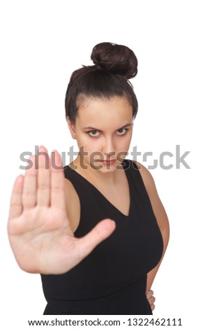 Angry woman showing stop sign with hand on white isolated background