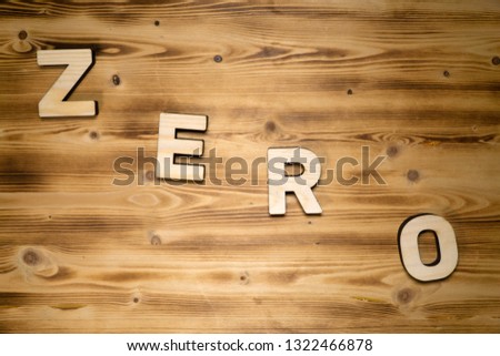 ZERO word made of wooden block letters on wooden board