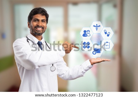 Indian physician or medic presenting health check concept by symbols on hexagon buttons with index finger