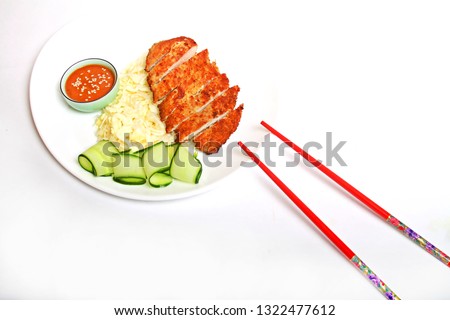 Asian food Japanese Katsu fried crispy chicken with sous deep and fresh salads served on plate isolated on white