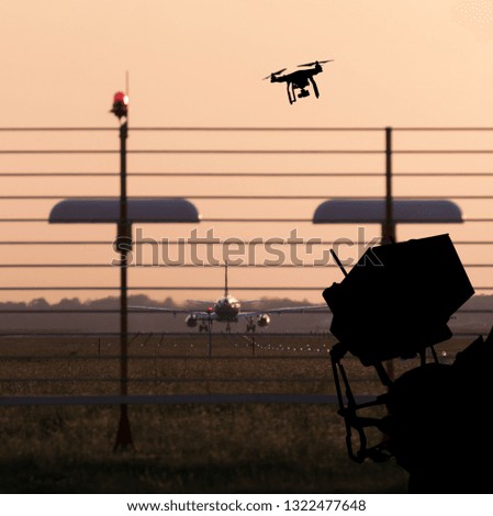 Drone flying near commercial airplane, danger of collision.