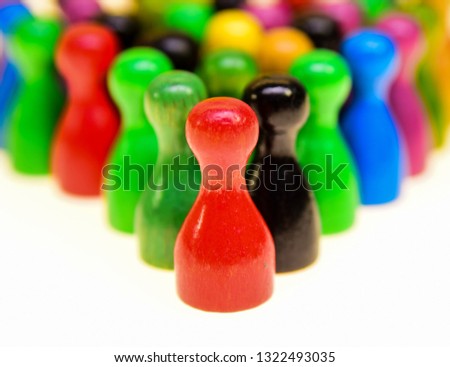 a picture of colorful chinese checkers figures