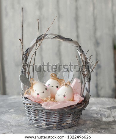 Easter decoration for home, handmade work, cute eggshell rabbit in a basket, beautiful background for card design