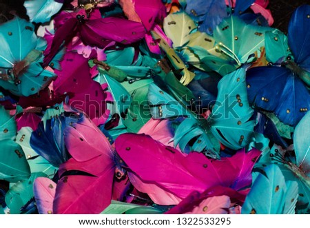 Feather butterflies colorful background image. Blues, pink and turquoise .