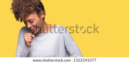 Beautiful young african american woman over isolated background feeling unwell and coughing as symptom for cold or bronchitis. Healthcare concept.