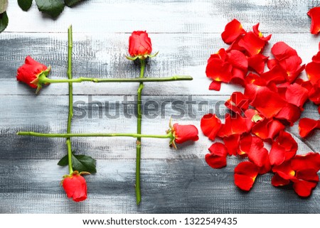 Hashtag sign made of flowers on wooden background