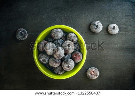 Frozen blueberries on dark background