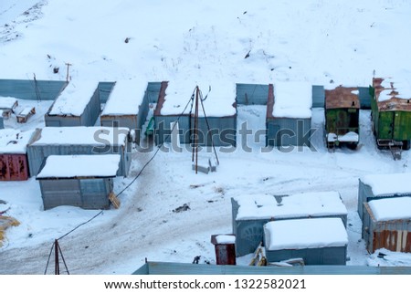 Winter cityscape. City aerial view. Residential trailers. The territory at the construction site.
