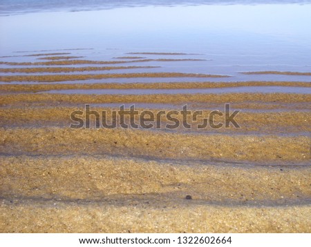 Sand on the lake in winter