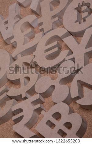 Various Wooden Sings or Symbols of World Currencies in Group Picture with Diffused Light