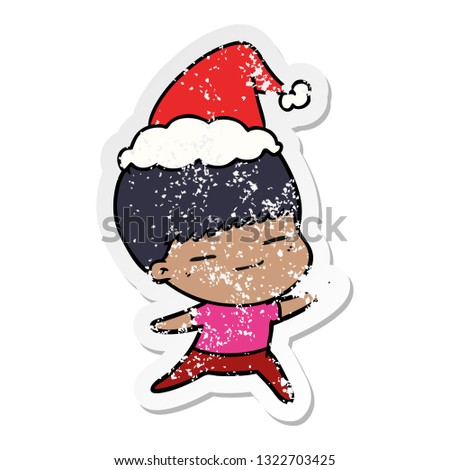 hand drawn distressed sticker cartoon of a smug boy wearing santa hat