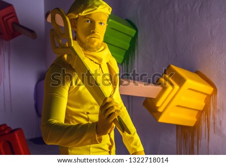 Stylized fantasy actor in scenic make-up and bright colored background.