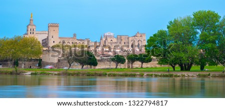 Popes Palace and Rhone river in Avignon at sunset, France. Beautiful picture of travel destination in France.
