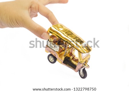 Tuk Tuk -  Thailand taxi model, mini toy on isolated white background