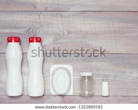 Plastic items on wooden background