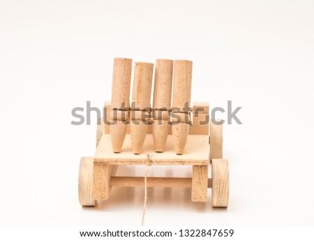 toy car made of natural wood stands on white background, buy a wonderful object with pull rope.