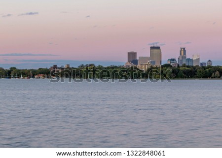 A Shot of the Minneapolis Skyline Rising Above Lake Bde Maka Ska in South Minneapolis during a Summertime Dusk