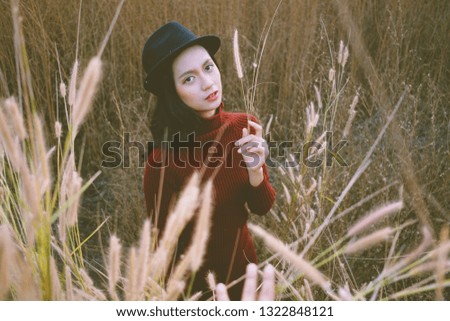 Portrait beautiful young woman at field grass with happy emotion.