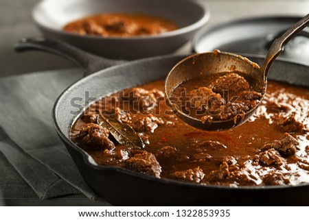 Served of portion of traditional Beef stew - goulash  Royalty-Free Stock Photo #1322853935