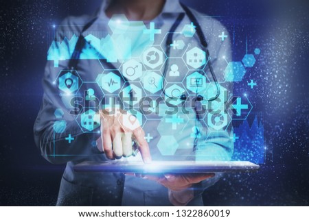 Female doctor hand using tablet with medical interface on blurry. Medicine and innovation concept. Double exposure 
