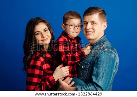 happy family mother, father, child son at studio 