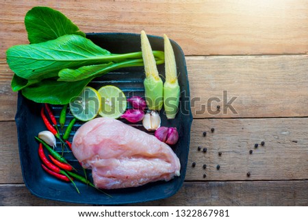 
Chicken, spices and vegetables prepared in a pan.
Food that has health benefits.