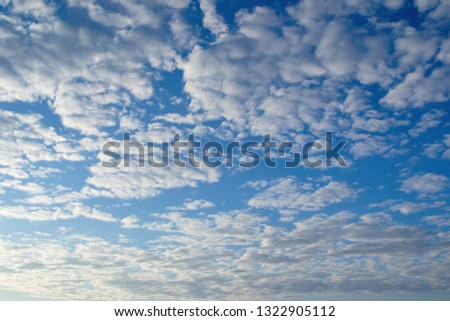 Beautiful celestial landscape. Clouds and sun at sunset. Clouds and sun at dawn. The radiance of the sunlight.