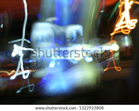 Blurred light effects. Neon glow. Festive decoration. Abstract background. Colorful pattern.
