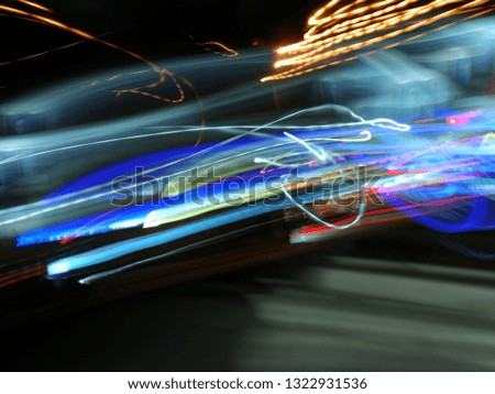Blurred light effects. Neon glow. Festive decoration. Abstract background. Colorful pattern.