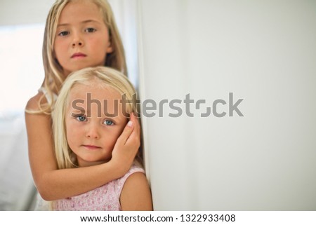 Portrait of two young sisters.