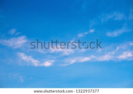 A pattern of white cloud in beautiful blue sky. This picture was shot in bright day light. It can be used as background. Nature and peaceful summer concept.
