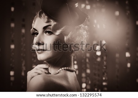Toned picture of  elegant blond retro woman   wearing little hat