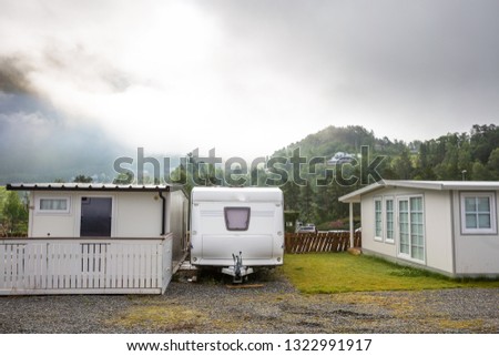 Motorhomes at campsite by the Geirangerfjord in Norway. Concept pictures.