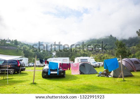 Motorhomes at campsite by the Geirangerfjord in Norway. Concept pictures.