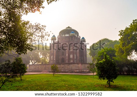 Humayun's Tomb in New Delhi, India. - Majestic views of the first garden-tomb on the Indian subcontinent. The Tomb is an excellent example of Persian architecture. Located in the Nizamuddin East Delhi Royalty-Free Stock Photo #1322999582