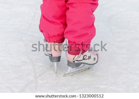 Child skating on the rink