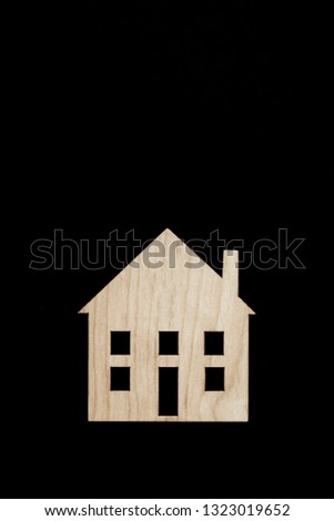 The image of the house on the black background. Wooden lodge.  Concept purchase, rent of housing. Copyspace